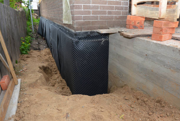 Happy homeowners after waterproofing job in Wingate